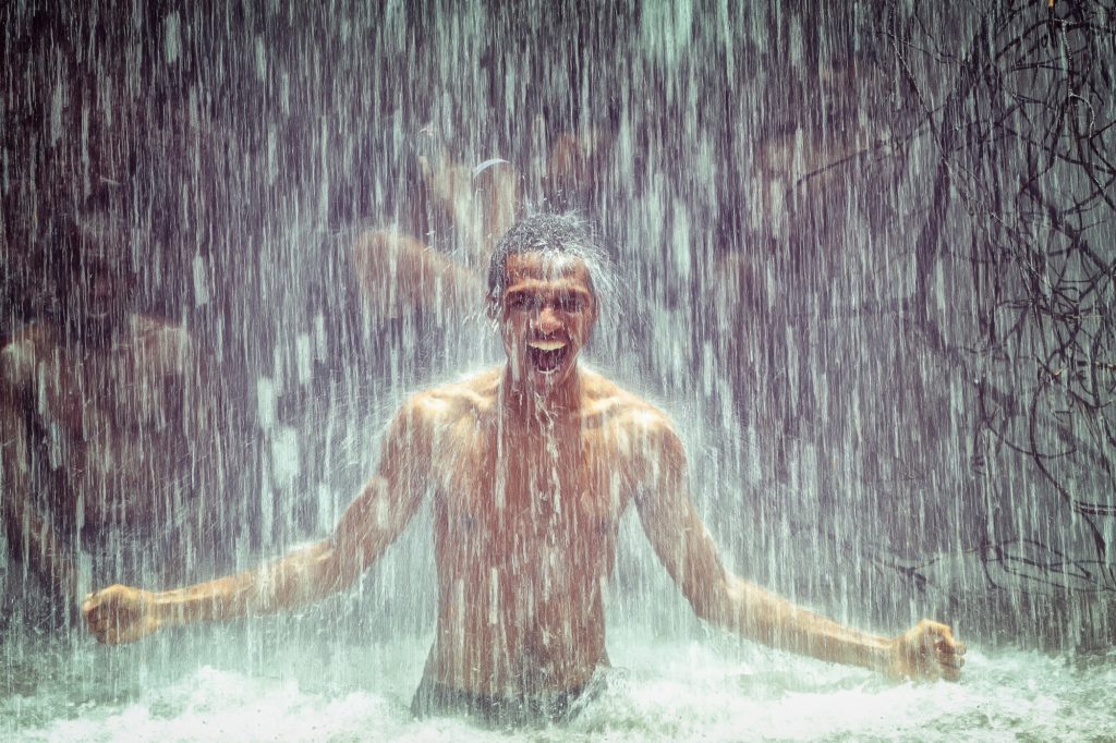 man-under-waterfall-2150164